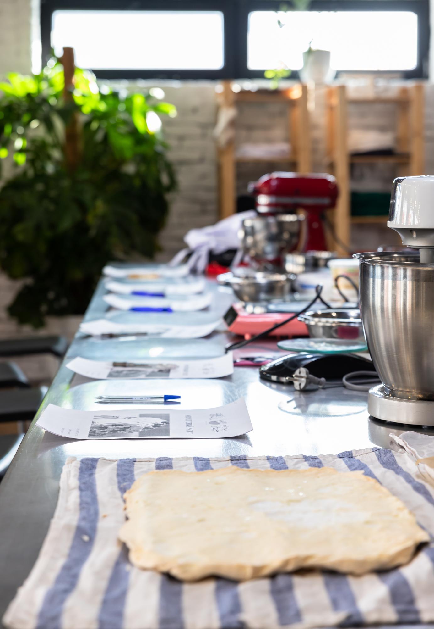 Workshop table set for a hands-on cooking lesson